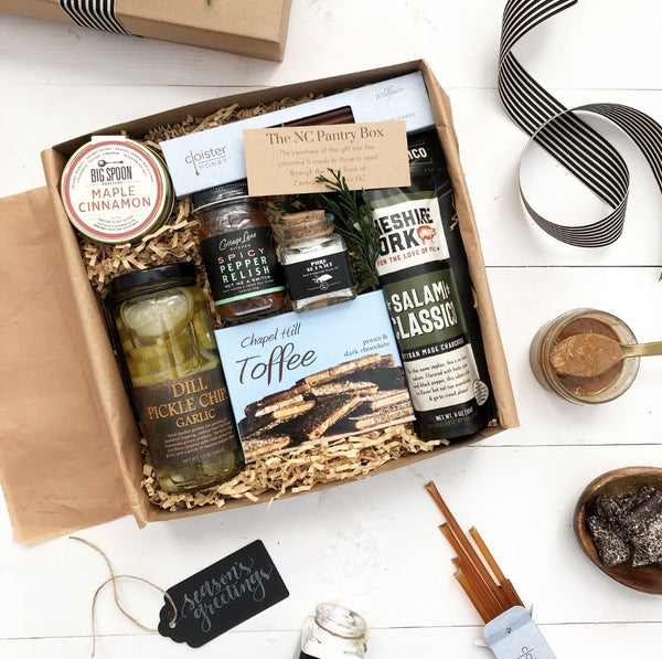 NC Pantry Box - A gift box full of North Carolina made favorites.  Includes maple cinnamon nut butter from Big Spoon Roasters, Wildflower honey straws by Cloister Honey, Classic Salami charcuterie by Cheshire Smokehouse, Chapel Hill Toffee, Sea Love Salt 